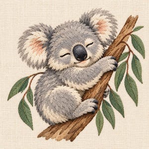 May include: An embroidery design featuring a gray koala with fluffy ears and a black nose, sleeping while clinging to a textured brown tree branch. The branch is adorned with several green eucalyptus leaves on a light beige fabric background.