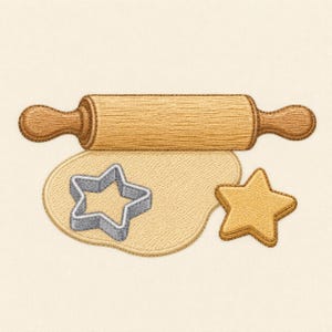 May include: An embroidery design featuring a brown wooden rolling pin positioned above a piece of light tan rolled dough. A silver star-shaped cookie cutter sits on the dough, accompanied by a single star-shaped cookie to the right side.