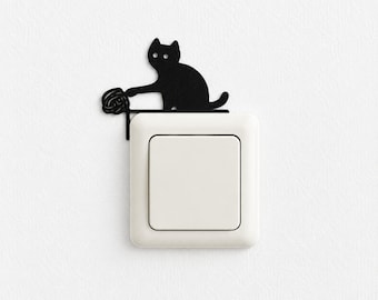 Light switch decoration | Naughty cat knocking over a can of paint