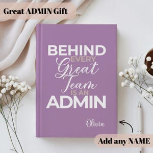 May include: A lavender journal with the text "BEHIND EVERY Great Team IS AN ADMIN" in white. The journal has the name "Olivia" printed on it. The words "Great ADMIN Gift" are at the top. A pen and a cup of coffee are next to the journal.