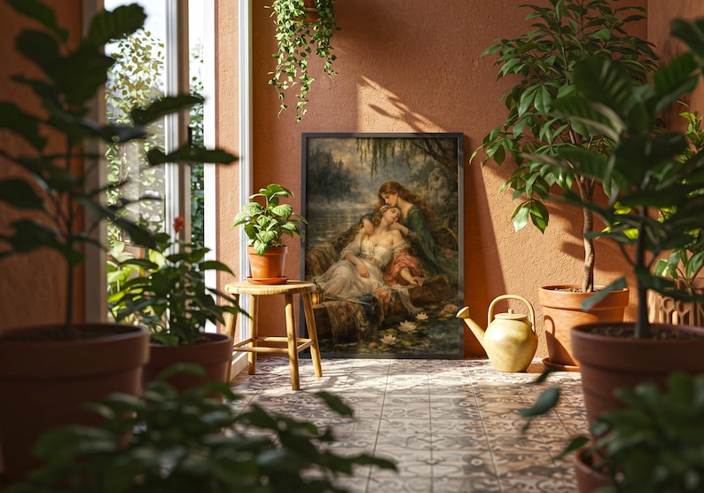 May include: A framed rectangular wall art print featuring a classical painting of two figures resting by a water's edge with lily pads. The artwork is displayed in a sunlit room with terracotta-colored walls, surrounded by various potted green plants.