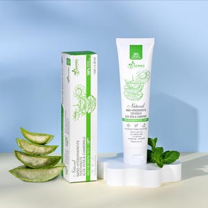 May include: A white tube and box of "Natural Nano-Hydroxyapatite Toothpaste" with aloe vera and chamomile. The box and tube have green accents and illustrations of aloe vera and flowers. The tube is 130g / 4.58 oz.