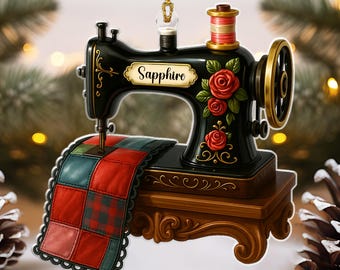 May include: A black sewing machine ornament with gold accents, red roses, and a spool of thread. The ornament features a small quilt and the name "Sapphire". A decorative item for the holidays.