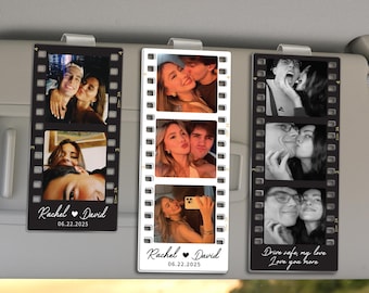May include: Three car visor photo clips with romantic images. Each clip features a film strip design with three photos. The clips have the names "Rachel & David" and the date "06.22.2025" printed on them. One clip has the text "Drive safe, my love, Love you more."