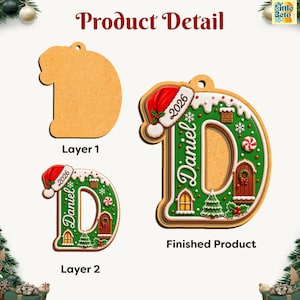 May include: A letter D shaped Christmas ornament featuring a Santa hat, the name Daniel, the year 2026, and holiday motifs like a tree, door, and candy. The product is shown in two layers, a plain wooden base and a finished, colorful top layer.
