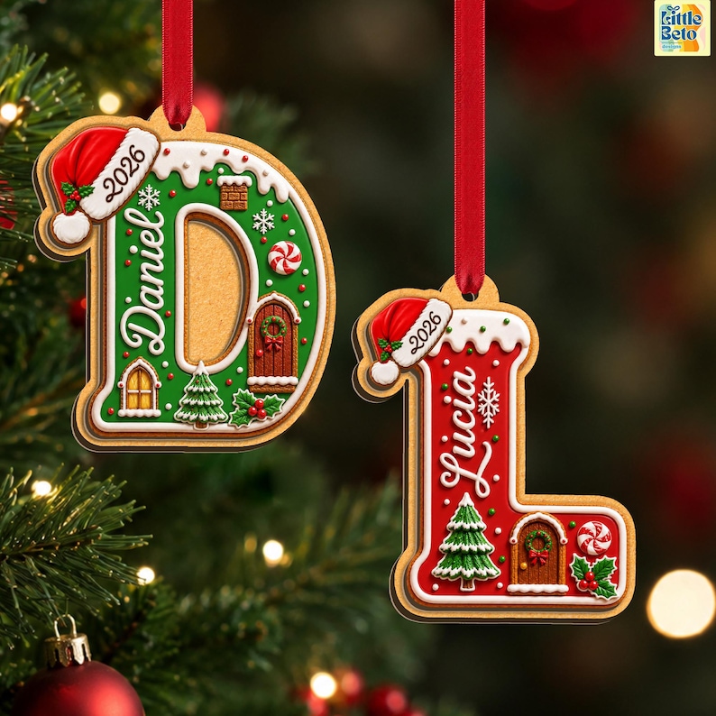 May include: Two hanging Christmas ornaments shaped like the letters D and L, designed to look like gingerbread cookies. The green D features the name Daniel and the year 2026, while the red L features the name Lucia and the year 2026.