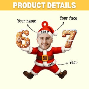 May include: A festive Santa Claus figure with a personalized face and name, holding gingerbread cookies shaped like the numbers 6 and 7. The figure is wearing a red suit with a gold belt and the year 2025 is displayed.