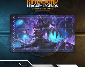 May include: A rectangular Riftbound League of Legends trading card game playmat. The mat features a detailed illustration of a character with purple and blue hues. The mat has designated zones for cards and a numbered border.