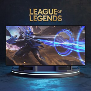 May include: A computer monitor displaying a League of Legends graphic. The screen shows a blue and black character with a weapon. The monitor sits on a dark blue and black stand with a white light.