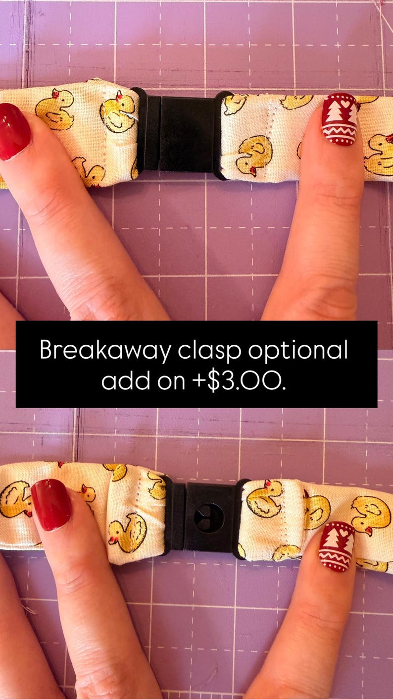 May include: A fabric strap featuring a repeating pattern of yellow ducks on a cream background, equipped with a black plastic breakaway clasp. The text Breakaway clasp optional add on +$3.00 is displayed across the centre of the image.