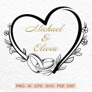 Op de afbeelding: Een zwart hartvormig ontwerp met de namen "Michael & Olivia" in gouden letters. Twee in elkaar grijpende trouwringen aan de onderkant, met bloemen- en bladaccenten. Geschikt voor huwelijksuitnodigingen.