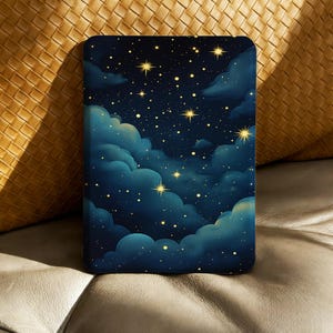 May include: A rectangular case with a night sky design. The artwork shows dark blue clouds, golden stars, and a deep blue background. The case is likely for a tablet or e-reader.