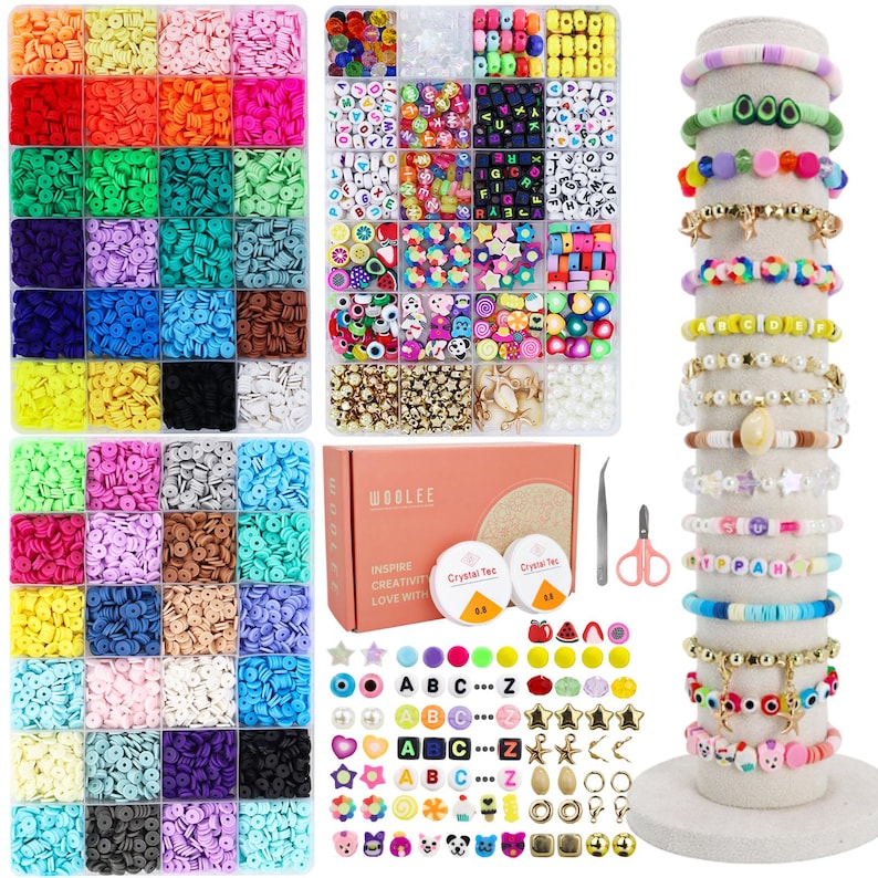 May include: A collection of colorful polymer clay beads, letter beads, and charms for jewelry making. Includes a variety of shapes, sizes, and colors, along with tools and string. Several handmade bracelets are displayed on a cylindrical stand.