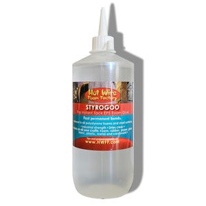 May include: A clear plastic bottle of Styrogoo instant tack EPS foam glue. The label features the text "Hot Wire Foam Factory" and product details. The glue is designed for fast, permanent bonding to various materials, including foam, rubber, and plastic.