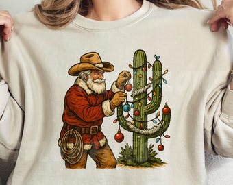 PNG de Papá Noel vaquero retro, gráfico de camiseta con cactus y árbol de Navidad del oeste, PNG para sublimación navideña del oeste, PNG navideño preppy