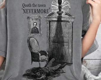 May include: Gray t-shirt featuring a black and white illustration inspired by Edgar Allan Poe's "The Raven." The design includes a raven, a portrait, a chair, and the text "Quoth the raven 'Nevermore'".