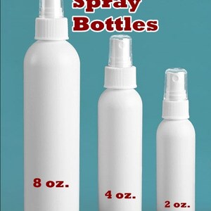 May include: Three white plastic spray bottles with different sizes: 8 oz, 4 oz, and 2 oz.  The bottles are on a blue background.