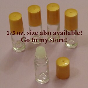 May include: Five clear glass roller bottles with gold lids. The bottles are 1/3 oz. size and are available in the seller's store.