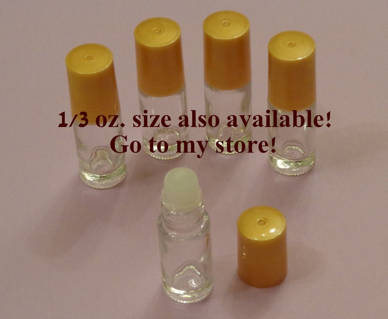 May include: Five clear glass roller bottles with gold lids. The bottles are 1/3 oz. size and are available in the seller's store.