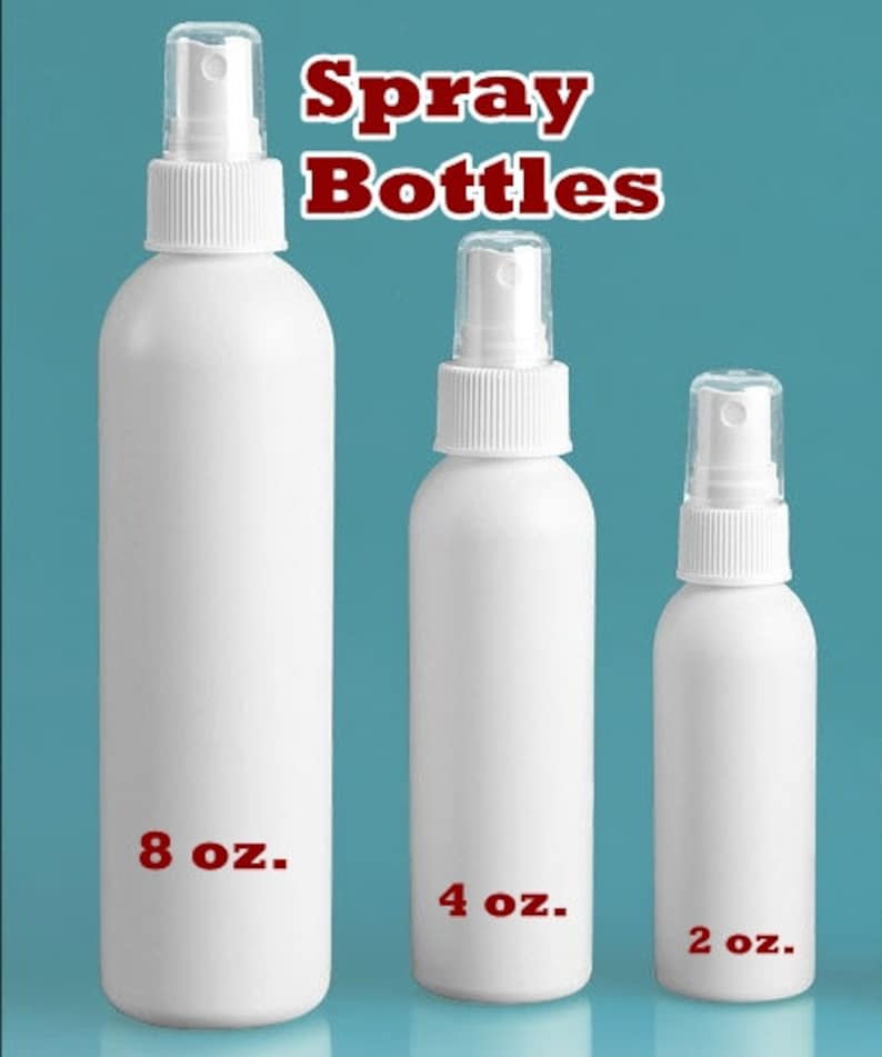 May include: Three white spray bottles of varying sizes, labeled 8 oz, 4 oz, and 2 oz. The bottles have white spray nozzles with clear plastic caps. The text "Spray Bottles" is in red at the top.