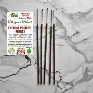 May include: Premium bamboo incense sticks, "Dragon's Blood", with the text "ENFORCE POSITIVE ENERGY". The sticks are brown with a thin, uncoated end. The image also includes text about the product's features and use.