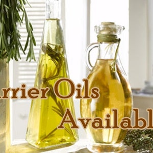 May include: Two glass bottles of carrier oils, one clear and one amber, with sprigs of rosemary and thyme. The text "Carrier Oils Available!" is displayed on the image.