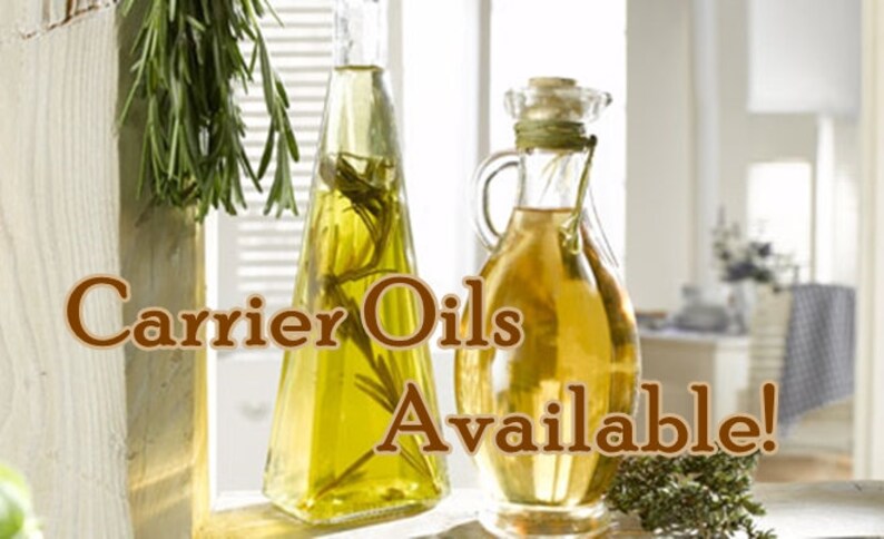 May include: Two glass bottles of carrier oils, one clear and one amber, with sprigs of rosemary and thyme. The text "Carrier Oils Available!" is displayed on the image.
