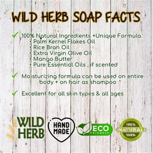 May include: A wooden background with text that reads "WILD HERB SOAP FACTS". The text lists ingredients like Palm Kernel Flakes Oil, Rice Bran Oil, and Mango Butter. Additional text states the soap is moisturizing and excellent for all skin types.