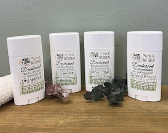 May include: Four white plastic deodorant sticks labeled Wild Herb Pure & Natural. Each container lists ingredients and specifies 2.65 oz. The labels indicate varieties: Unscented, Lavender, Citrus Edge, and Original Fresh, all stating no aluminum or baking soda.