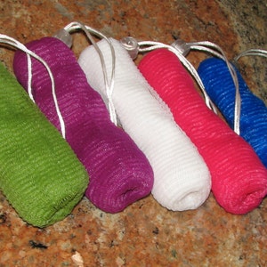 May include: Six colorful mesh soap bags with drawstring closures. The bags are green, purple, white, pink, and blue.