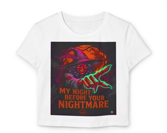 May include: White t-shirt featuring a Halloween-themed graphic. The graphic depicts a witch with a red face and a pointed hat, reaching out with a glowing green hand. The text "MY NIGHT BEFORE YOUR NIGHTMARE" is displayed in orange.