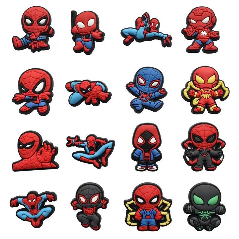 May include: A collection of sixteen individual shoe charms featuring various stylized depictions of the superhero Spider-Man in red, blue, and black color schemes. Each charm displays a unique pose or costume variation of the character in a flat, molded design.