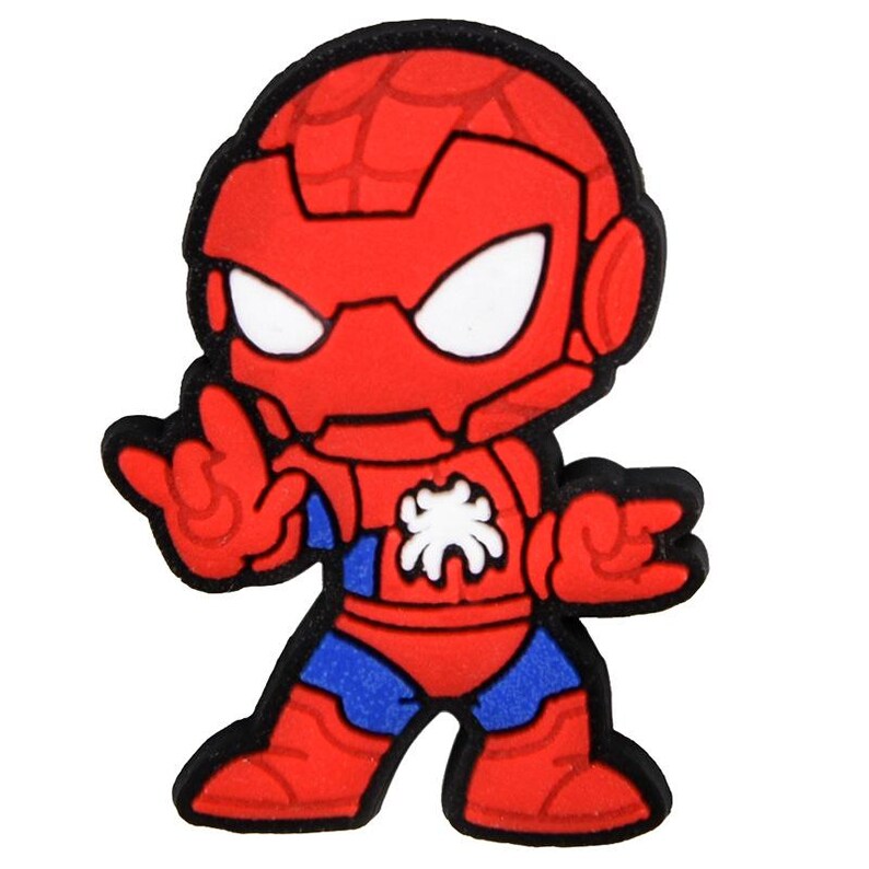 May include: A rubberized character charm featuring a stylized superhero in a red and blue suit with a white spider emblem on the chest. The figure has a large red head with a web pattern, white eye patches, and is posed with hands in a web-shooting gesture.