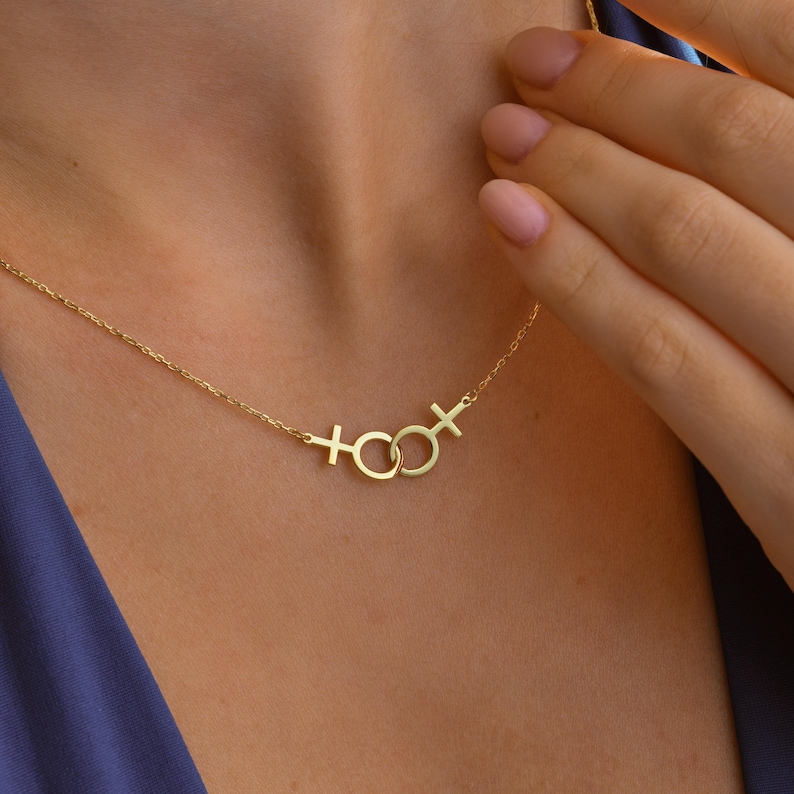 Model wearing Sterling Silver Double Venus Necklace – lesbian pride jewelry close-up.