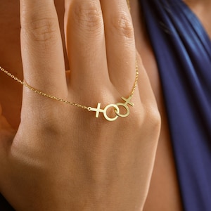 hand on Close-up of model showcasing 925 sterling silver double Venus pendant.