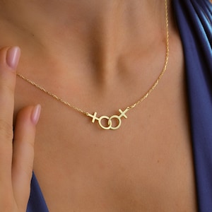 Double Venus Necklace layered with other minimalist silver chains