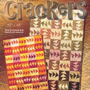 May include: A quilt pattern cover titled "Crackers" by Hoffman Fabrics. The cover features two quilts, one measuring 30" x 48", with geometric designs in shades of red, orange, yellow, and brown. The text "Foundation Paper Piecing" is at the top.