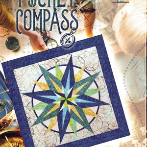 May include: A quilt pattern titled "Pocket Compass" featuring a compass rose design in shades of blue, green, and yellow. The quilt has a dark blue border and is set against a backdrop of a vintage map and compass.