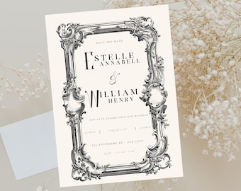 May include: A cream-colored wedding invitation with ornate black scrollwork framing the text. The invitation reads "SAVE THE DATE" at the top, followed by the names "ESTELLE ANNABELL & WILLIAM HENRY". Additional text includes the wedding date and location.
