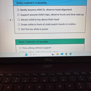 May include: A laptop screen displays a document with a checklist titled "Body control 1-5 months" and "Body control 6-10 months." The checklist includes instructions for observing a child's development. The laptop's keyboard is visible below the screen.