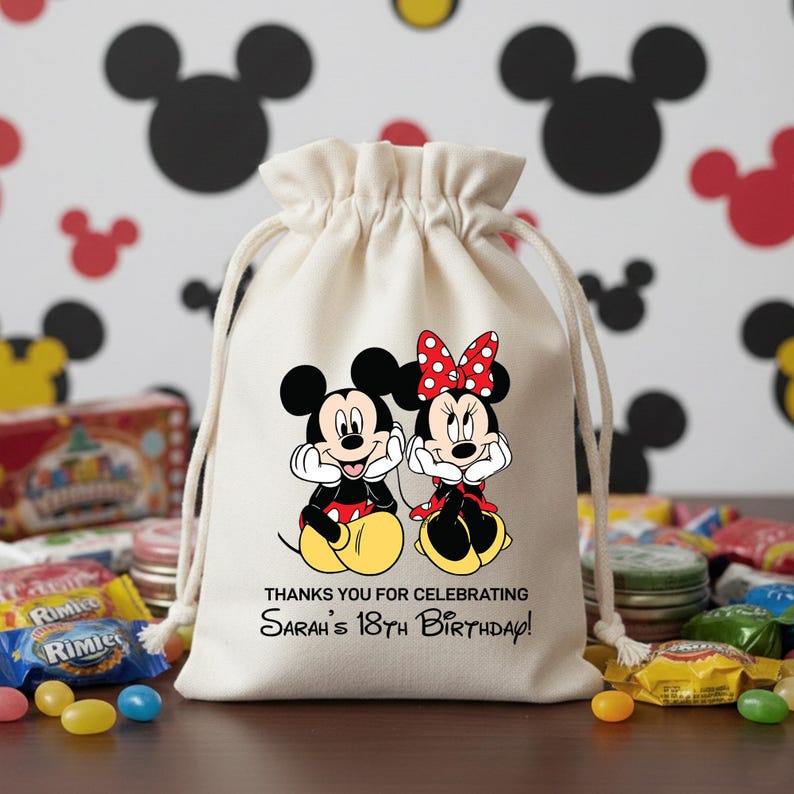 May include: A white ceramic mug with a black handle and the text "But First, Coffee" in a black, handwritten-style font. The mug is on a white surface.