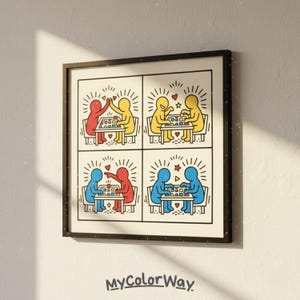 May include: Framed art print with a four-panel comic strip showing stylized figures in red, yellow, and blue. The figures are interacting, with high-fives and hearts. The print is in a black frame, with the text "MyColorWay" at the bottom.