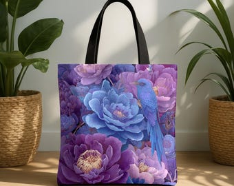 May include: A tote bag with a floral design featuring large purple and blue flowers and a blue bird. The bag has black handles and is made of a durable fabric. The design is vibrant and detailed, perfect for carrying groceries or personal items.