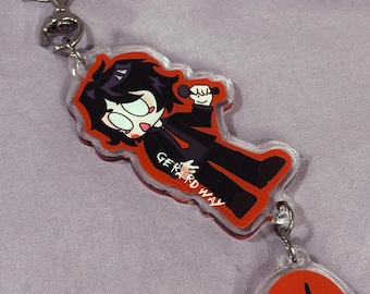May include: A clear acrylic keychain featuring a cartoon figure in a black suit with the text "GERARD WAY". The keychain has a red and black musical note charm and a silver bat-shaped clasp.