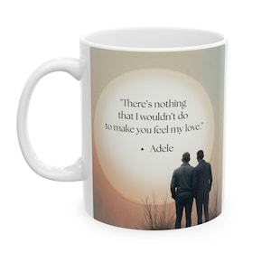 May include: White ceramic mug with a quote from Adele: "There's nothing that I wouldn't do to make you feel my love." The mug features a silhouette of two people and a soft, neutral background.