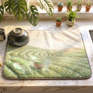 Puede incluir: Un juego de tres tazas de cerámica con acabado mate moteado. Las tazas son de color crema, gris claro y gris oscuro. Cada taza tiene un diseño simple y minimalista.