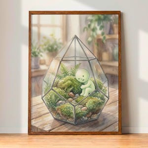 May include: A framed watercolor print of a terrarium with a geometric glass enclosure. Inside, a small green figure sits among moss and ferns. The artwork is set on a wooden table, with a soft, natural light.