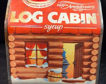 Lata de 100.º aniversario de Log Cabin Syrup 1887-1987, publicidad metálica vintage.