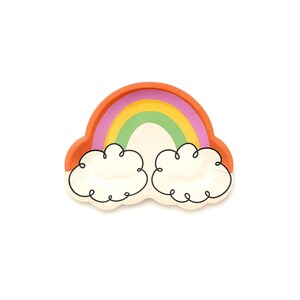 May include: A rainbow-shaped paper plate with a colorful rainbow design and two cloud-shaped sections. The rainbow features orange, pink, yellow, and green arches. The clouds are white with black outlines.