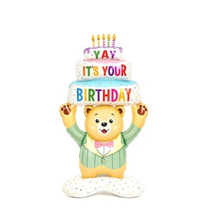 May include: A cheerful bear-shaped balloon holding a three-tiered birthday cake. The cake has the words "YAY", "IT'S YOUR", and "BIRTHDAY" in colorful letters. The bear wears a green suit and a pink bow tie.